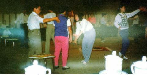 Clouds of light are photographed as Qi gong healers "open the meridians" of participants of CHI Tour '96 in Beijing China. No special lighting effects were used.